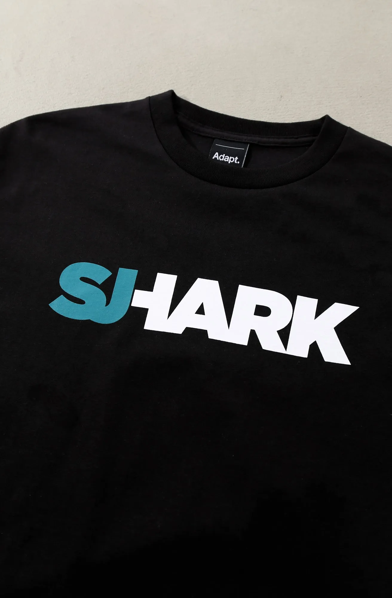 Breezy Excursion X Adapt :: Shark (Men's Black Tee)